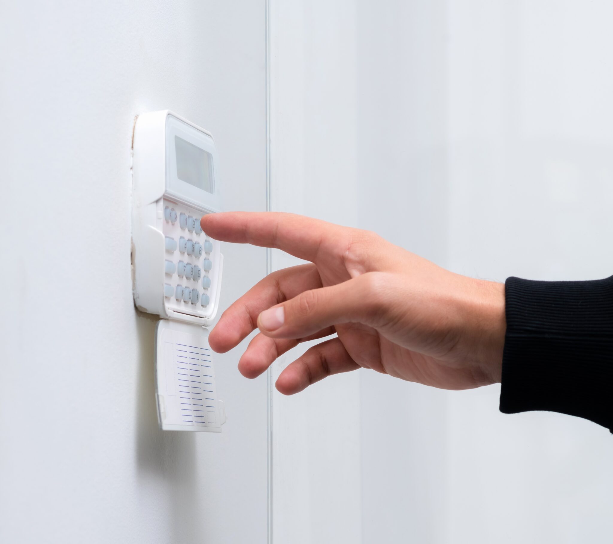 hand-entering-alarm-system-password-apartment-home-business-officeww-2048x1817.jpg